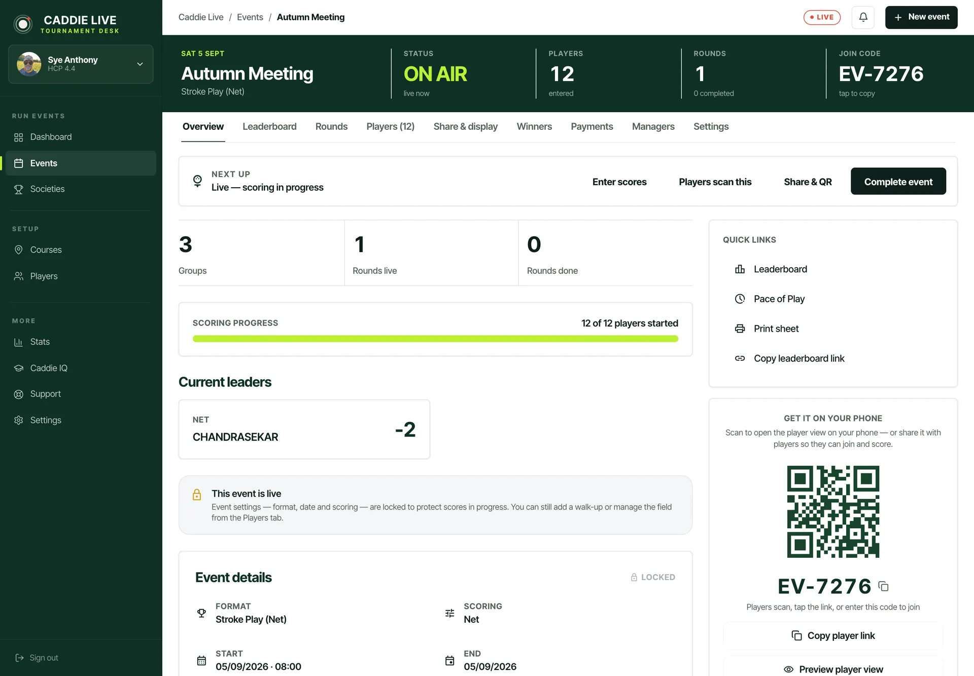 The Caddie Live organiser desk on a laptop: an event running live with twelve players entered, three tee groups, the join code and a QR code for players to scan